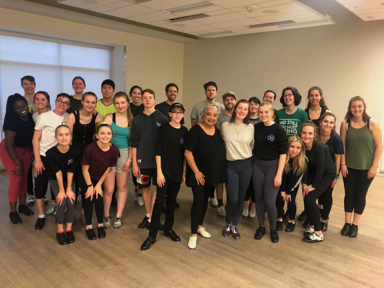 Group of dancers posing in dance studio